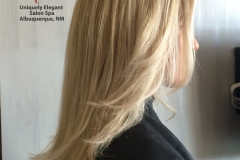 Full colored blonde highlights and long layered haircut