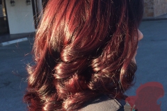 Vibrant red color and layered haircut